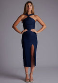 Front image of a model wearing the Vesper Aida Cross Neck Midaxi Dress in Navy, featuring a crossover neckline and sleek midaxi silhouette, photographed in a studio setting.
