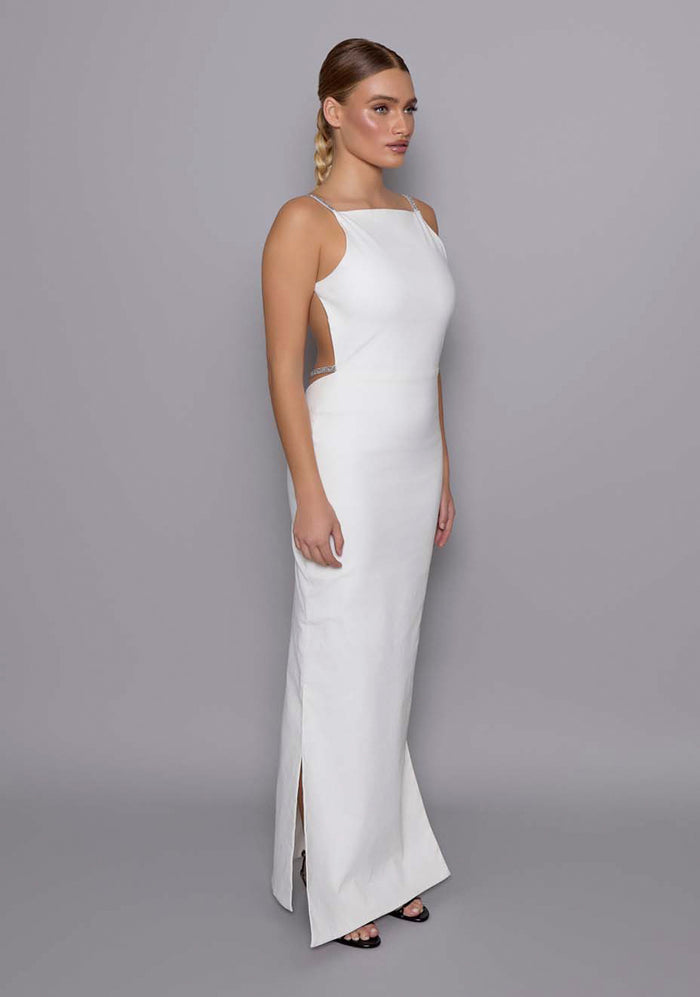 Side-front view of the VSPR Alba Ivory Maxi Dress showcasing the sculpting fit, minimalist design, and the elegant square neckline contour.