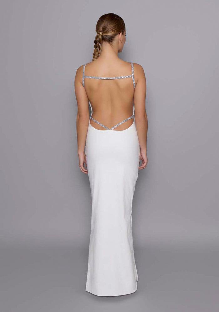 Back view of the VSPR Alba ivory Maxi Dress featuring deep open-back design framed with glittering silver crystal-embellished straps and clean, tailored lines.