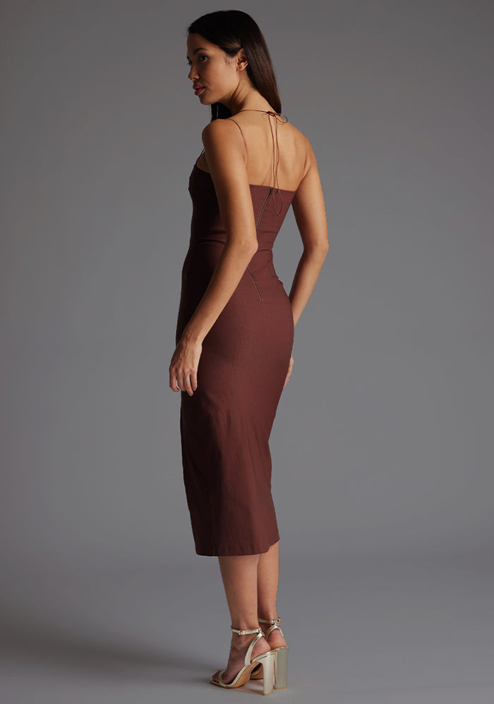 Side back image of a model wearing the Vesper Alyssa Strappy Thigh Split Midaxi Dress in Chocolate, showcasing the elegant strap detailing and smooth, body-skimming fit in rich chocolate brown.