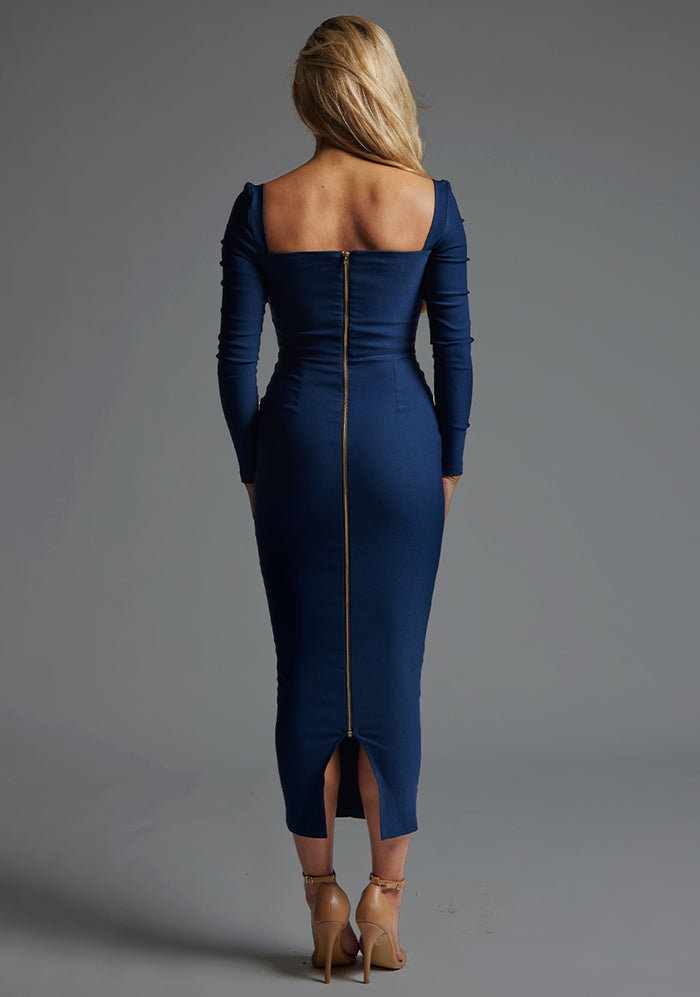 Back image of a model wearing the Vesper Amy Sweetheart Neckline Long Sleeve Midaxi Dress in Navy, featuring a gold zip closure and streamlined midaxi silhouette.