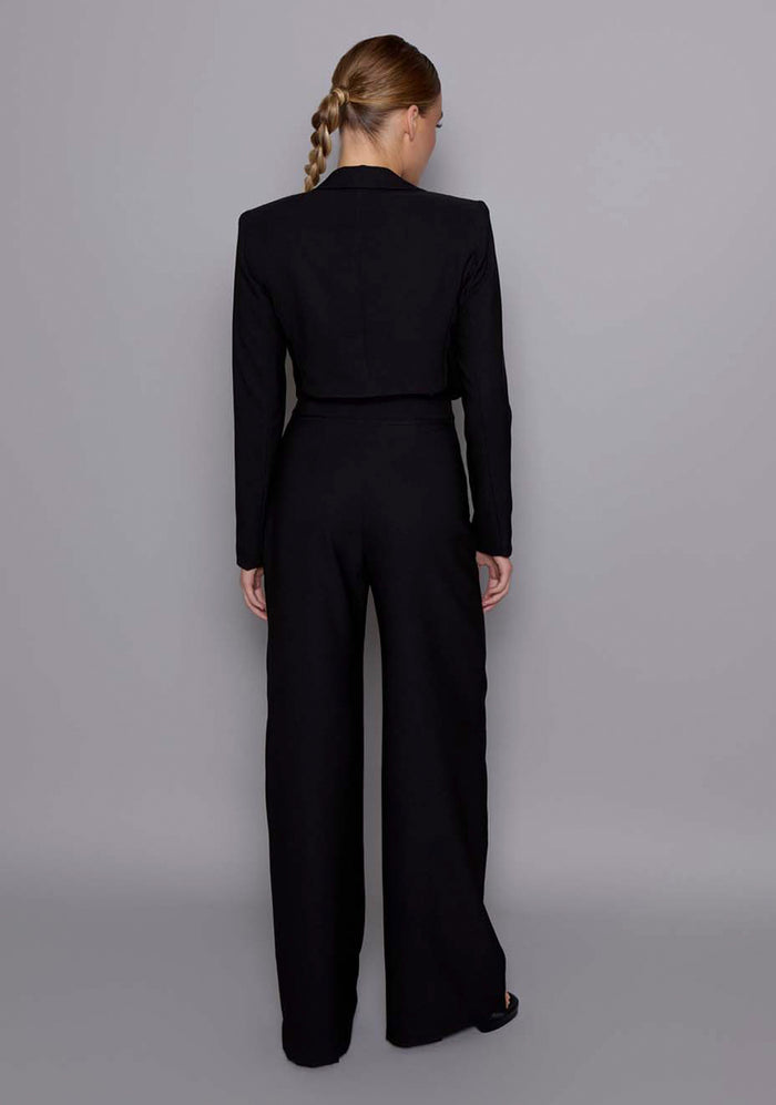 Back view of the VSPR Aria black jacket revealing a clean tailored finish, structured shoulder line, and contoured silhouette from behind.