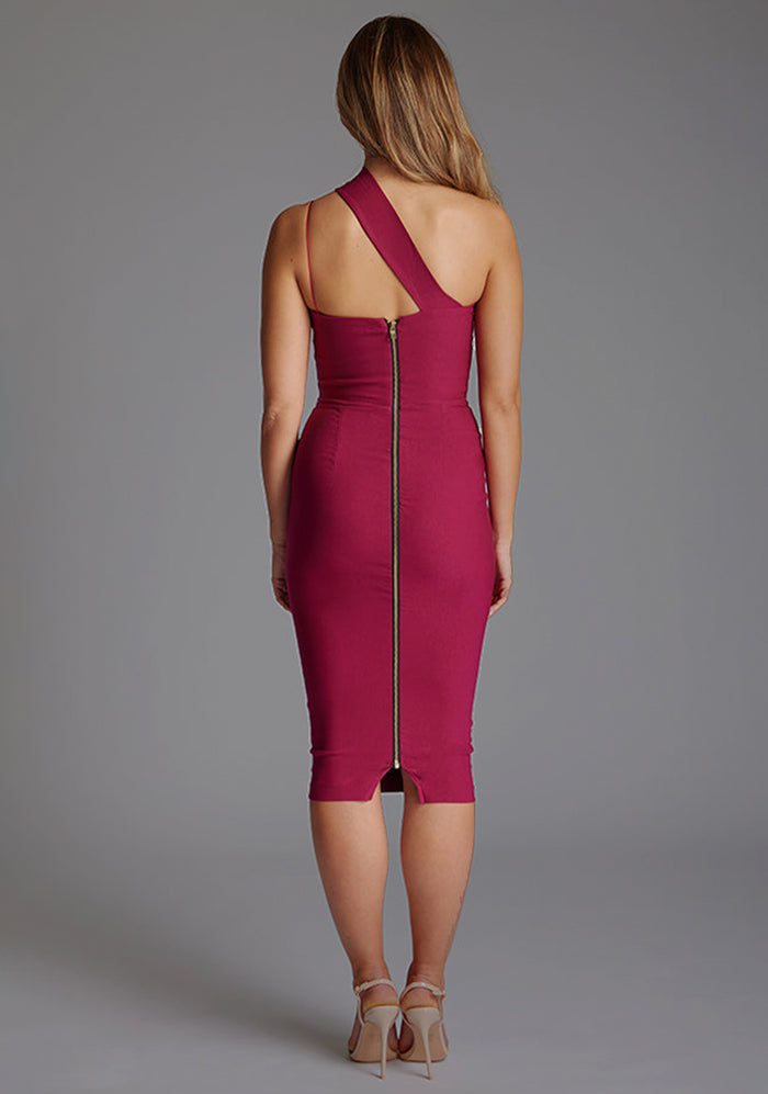 Back image of blonde model wearing a berry midi dress with a asymmetric design, one shoulder and a bodycon dress. The design features is the Vesper Ariel Berry Midi Dress