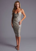 Front image of a model wearing the Vesper Ariella Sweetheart Neckline Midi Dress in Gold Sequin with aeaturing a romantic sweetheart neckline and body-contouring fit, standing against a grey studio backdrop.