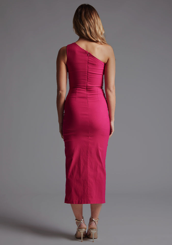 Back image of a model wearing the Vesper Ava One Shoulder Midaxi Dress in Cerise, highlighting the clean back finish and body-contouring silhouette.