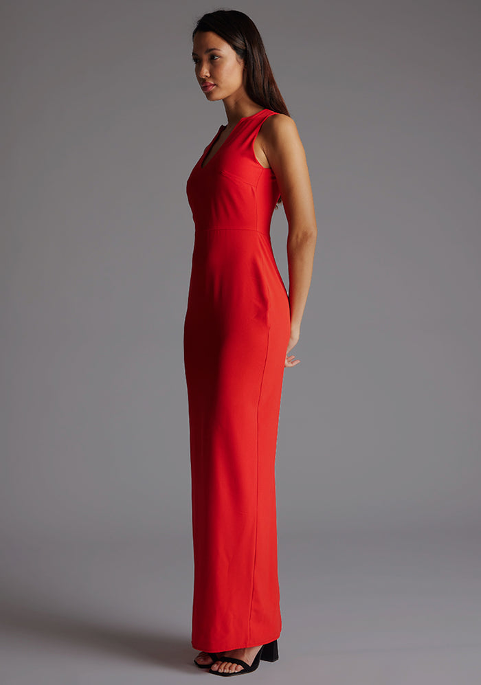 Side front image of a model wearing the Vesper Azalea V-Neckline Maxi Dress in Red showing the slim-fit profile and flowing maxi length.