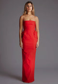 Front image of a model wearing a red square neck maxi dress with a chic straight neckline, delicate thin straps and sleek slim fit. The design featured is the Vesper Bergen Maxi Dress