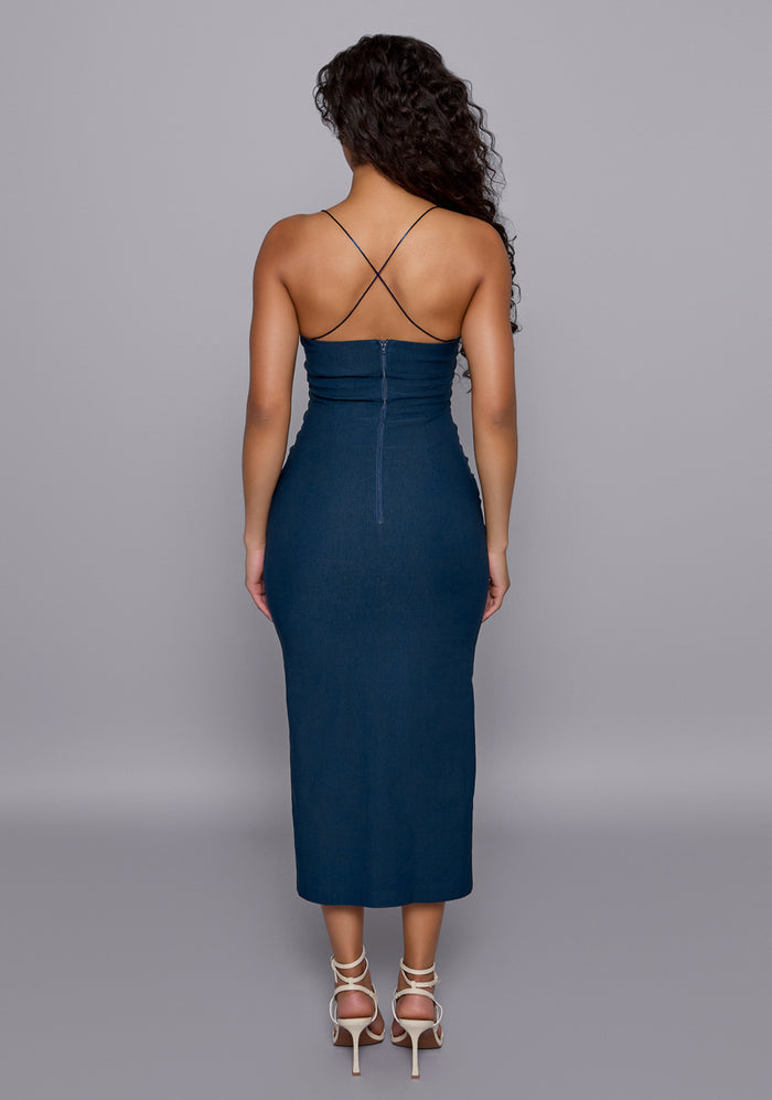 Back view of the VSPR Beryl Navy Dress featuring crisscross thin straps, clean back‑zip closure, and sleek fitted midaxi length that accentuates an elegant posture.