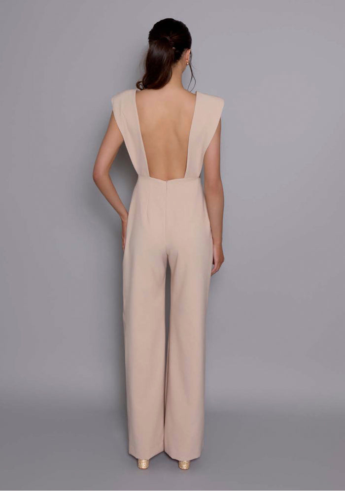 Back view of the VSPR Bronte open-back Jumpsuit revealing the deep open cut, highlighting the unexpected sensuality and clean silhouette of the design.