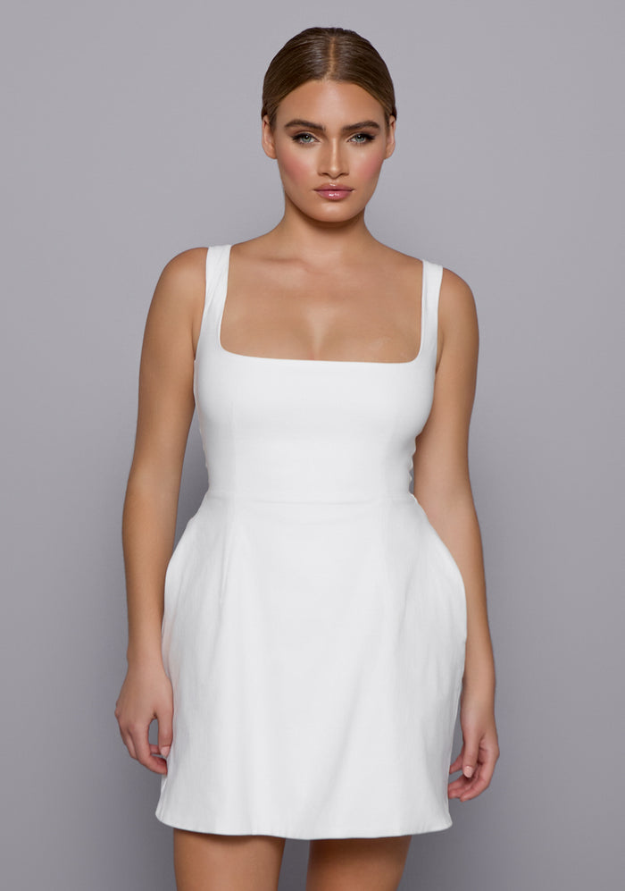 lose-up of the VSPR Camille Dress highlighting the square neckline, smooth stretch fabric, and refined seam detailing for a structured, polished look.