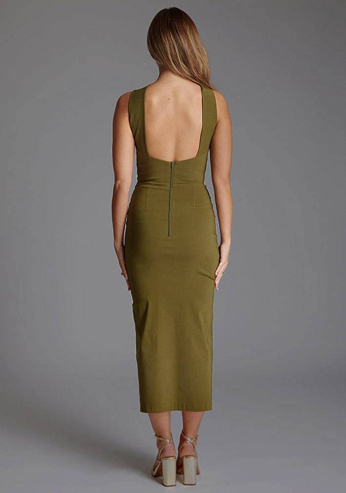 Back image of a model wearing the Vesper Carter Halterneck Bodycon Midaxi Dress in Olive, featuring a refined halter back and streamlined silhouette.