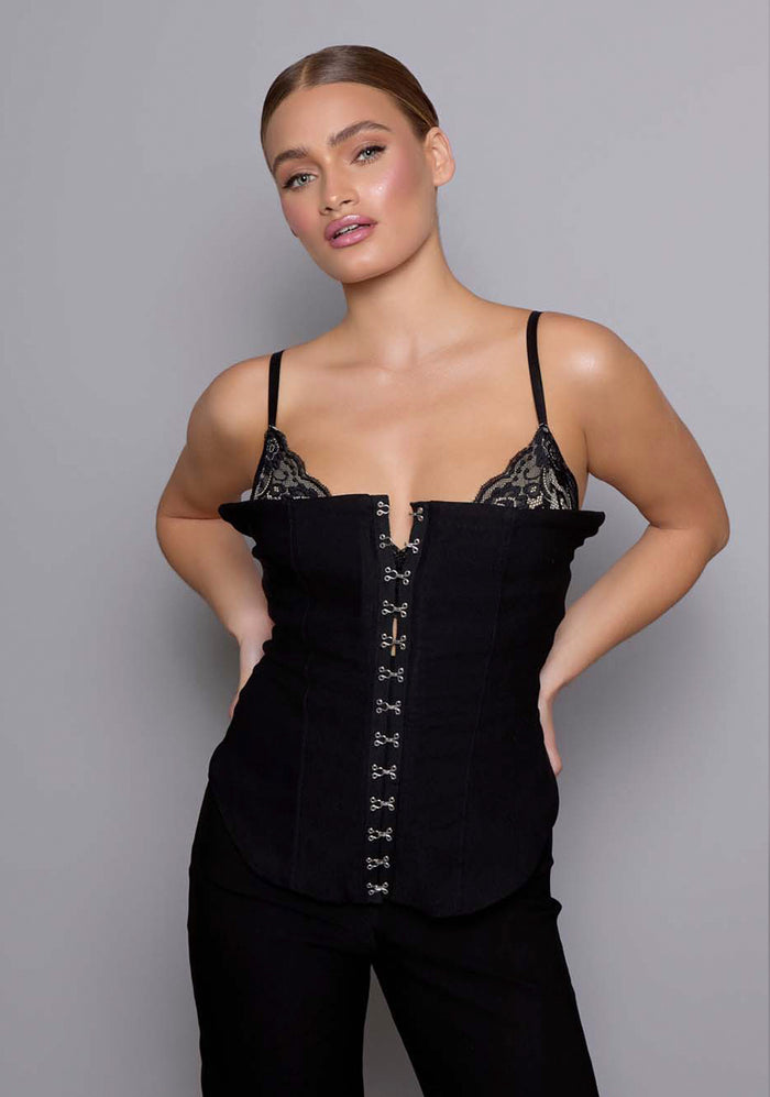 Close-up front of the VSPR Cassia Basque showing the structured stretch fabric, hook-and-eye closure, and lace-trimmed edging along the neckline for a refined finish.
