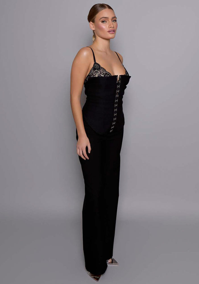 Side-front view of the VSPR Cassia black basque highlighting the corset-inspired silhouette, contoured bodice, and softly squared neckline framing the bust.
