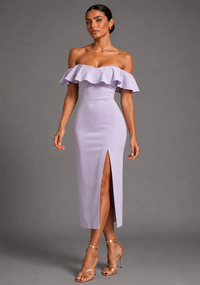 Front image of a model wearing the VSPR Deirdre Bardot Off-Shoulder Frill Lilac Midaxi Dress with an off-shoulder Bardot neckline, layered frill detailing, front skirt split, and elegant midaxi silhouette, standing against a grey studio backdrop.