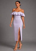 Front image of a model wearing the VSPR Deirdre Bardot Off-Shoulder Frill Lilac Midaxi Dress with an off-shoulder Bardot neckline, layered frill detailing, front skirt split, and elegant midaxi silhouette, standing against a grey studio backdrop.