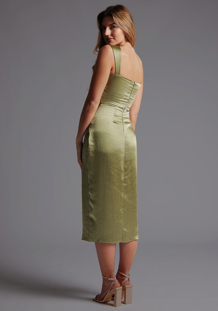 Back quarter image of a model wearing olive satin midaxi dress with  a sweetheart neckline, wide comfy straps and front skirt split. The dress featured is the Vesper Desiree Olive Satin Midaxi Dress.