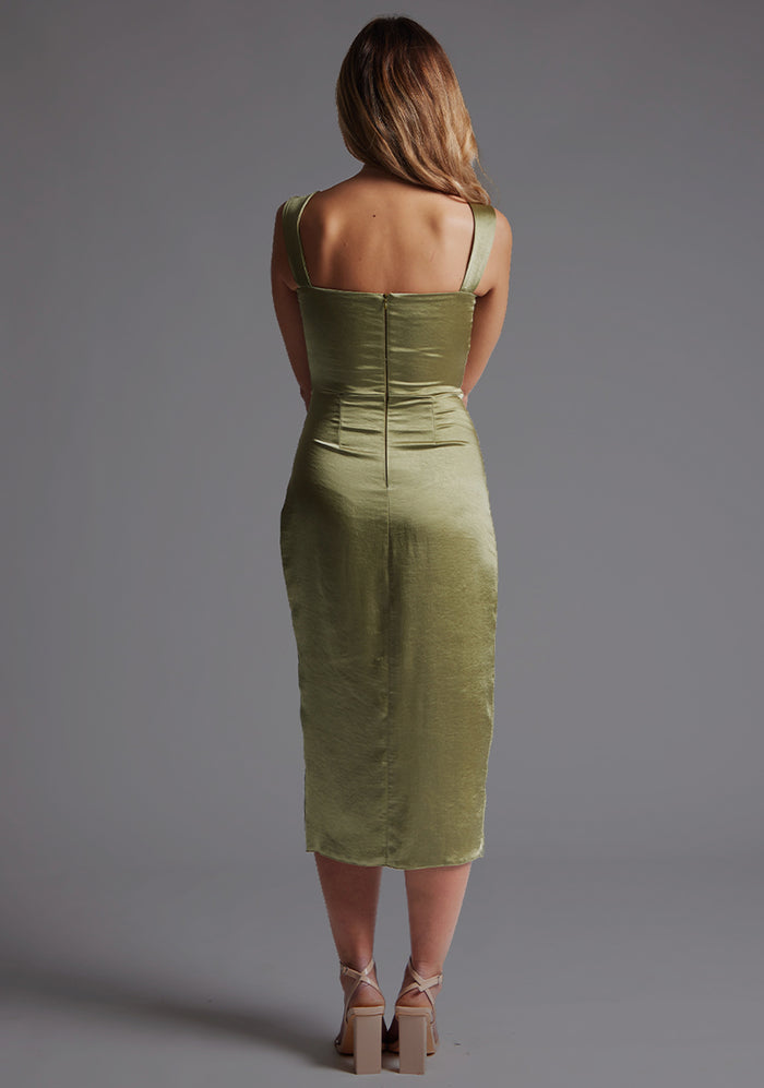 Back image of a model wearing olive satin midaxi dress with  a sweetheart neckline, wide comfy straps and front skirt split. The dress featured is the Vesper Desiree Olive Satin Midaxi Dress.